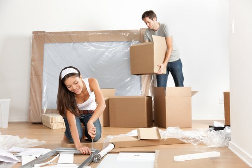 Packed moving boxes and furniture ready for local removals in Mile End