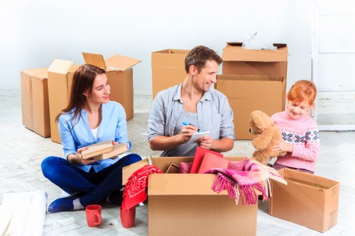 Local Mileend moving service organizing items for transport
