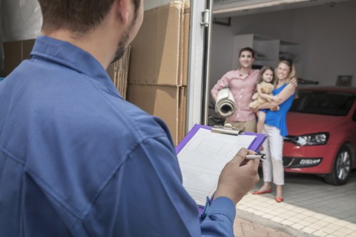 Professional man and van team in Mileend handling furniture
