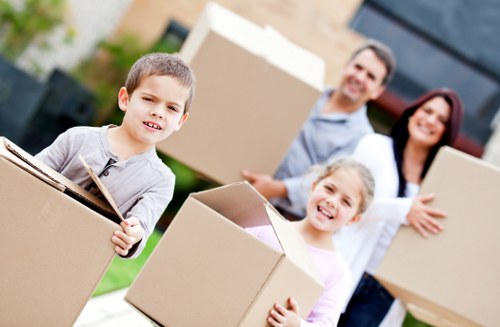 Packed household boxes ready for collection in Mile End