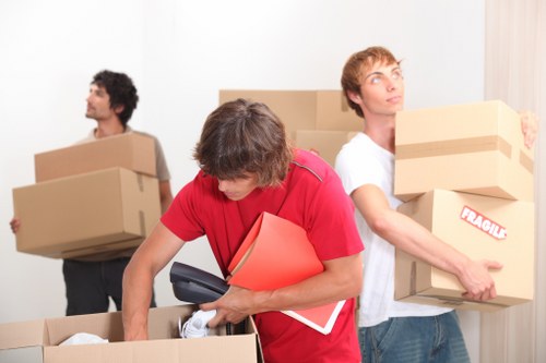 Moving team preparing boxes and furniture for a safe Man With Van Mileend job