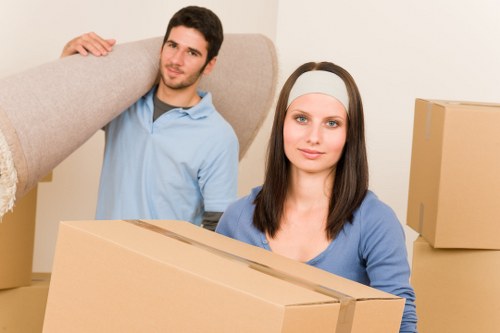 Movers handling stair access during a Mile End flat move