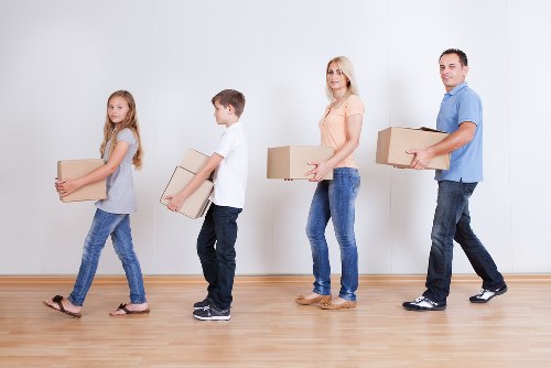 Removalists handling furniture access in an inner-west street