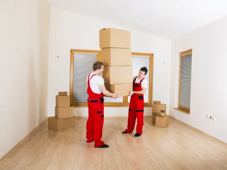 Professional movers handling flat access and staircase logistics